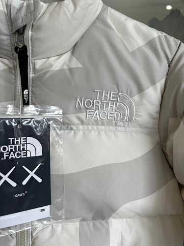 The North Face × KAWS Nuptse Down Jacket Cream XX Allover Print